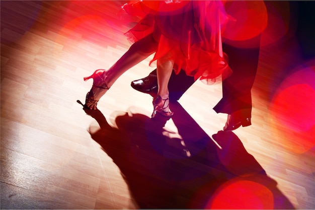 Man and a woman dancing Salsa on background