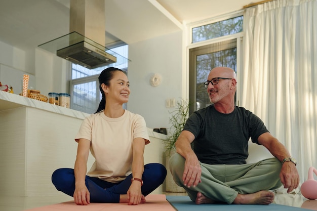 Man and woman doing stretching exercises