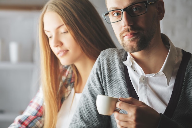 Man and woman drinking coffee