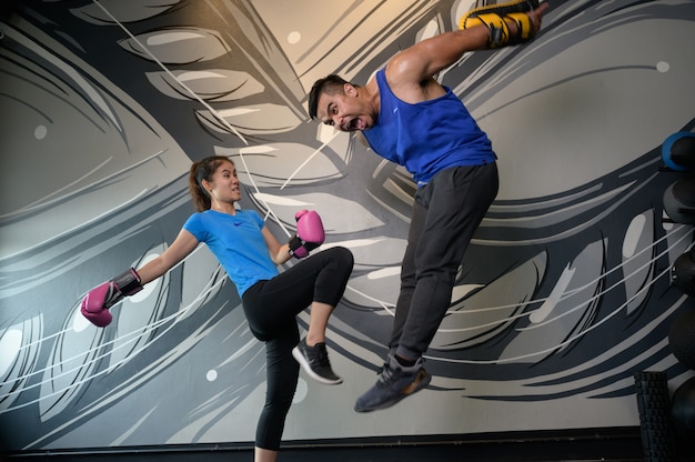 Man and woman exercising in the gym