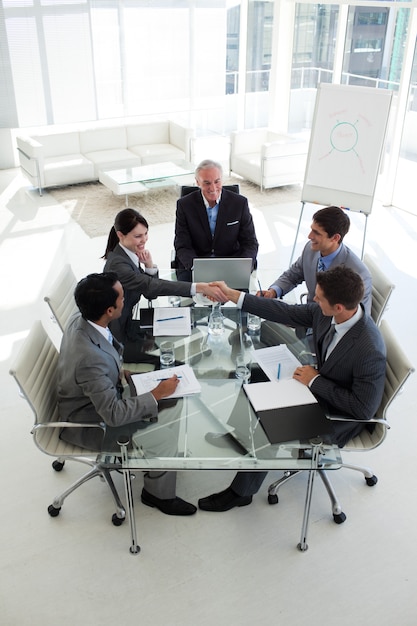 Man and woman greeting each other in a meeting