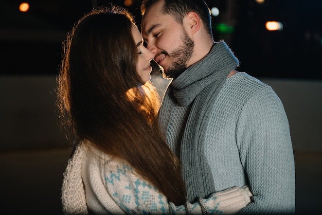 Man and woman on an ice skating rink