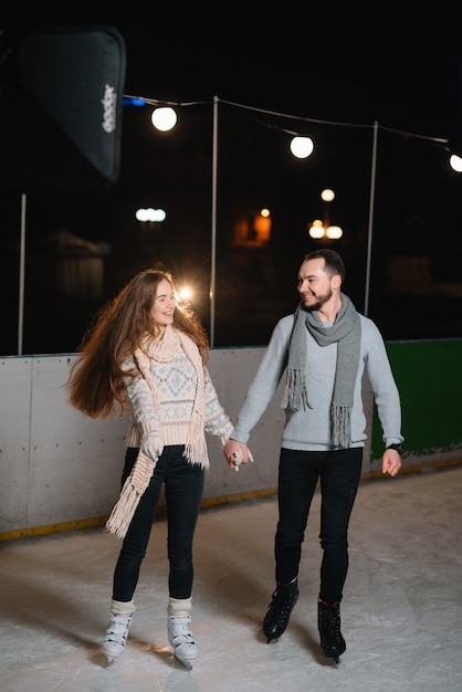 Man and woman on an ice skating rink