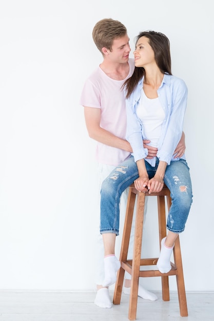 Man and woman looking at each other hugging couple communication