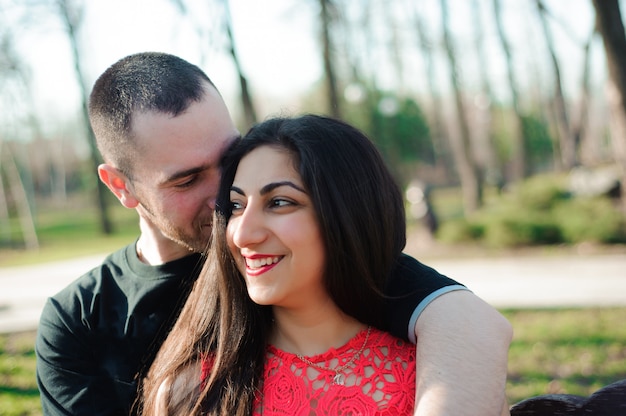 Man and woman in love posing in the park