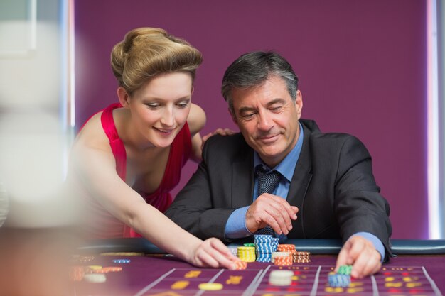 Man and woman placing bets
