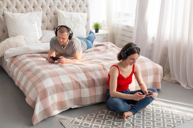 Man and woman playing videogames