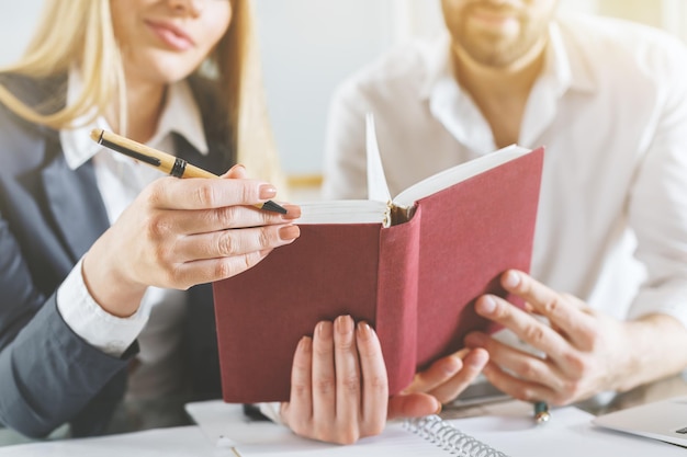 Man and woman reading book