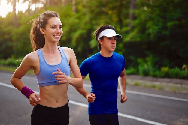 man and woman running outdoor