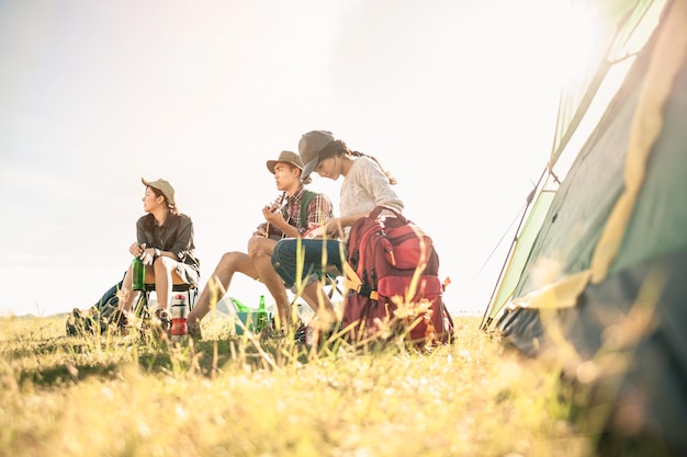 Man and woman sitting in chairs on camp.