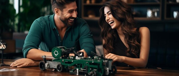 Photo a man and a woman sitting at a table playing with a toy car