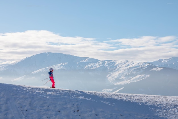 Man and woman skiing and snowboarding in the mountains ski resort