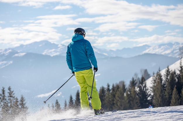 Man and woman skiing and snowboarding in the mountains ski resort