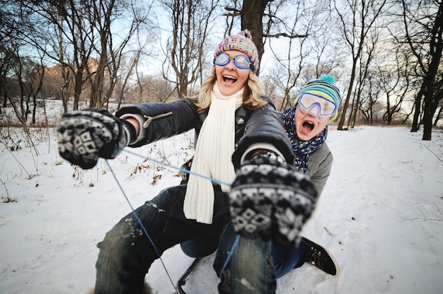 Man and woman on a sled