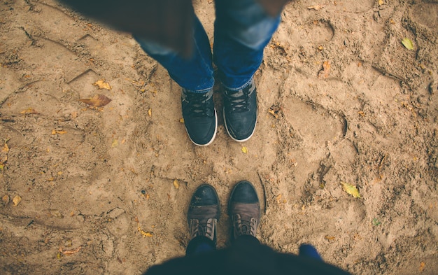 Man and woman stand opposite each other.