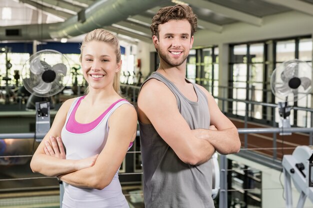 Man and woman standing at gym