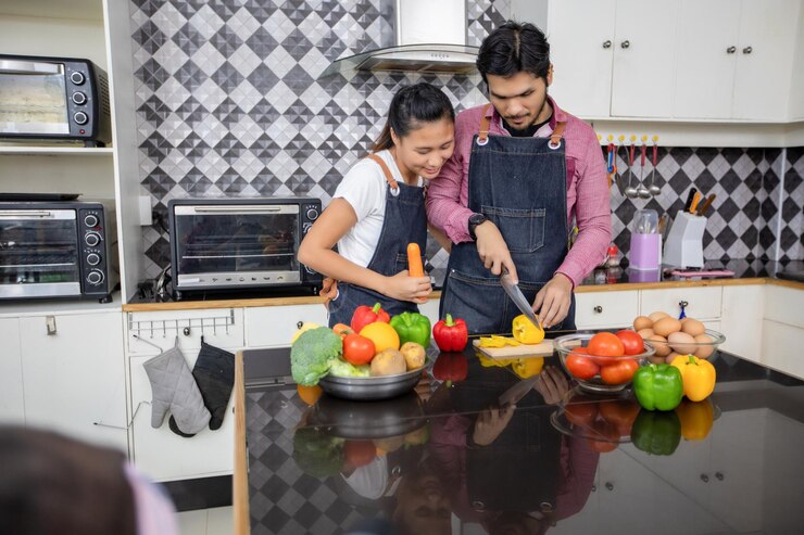 फोटो man and woman standing in kitchen at home