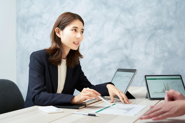 Man and woman in suits having a meeting