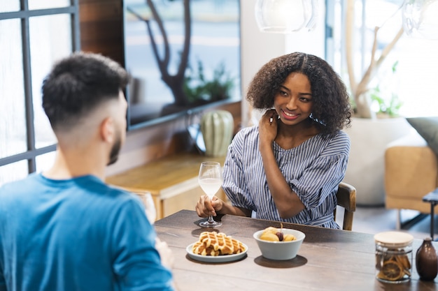 Man and woman talking with a smile