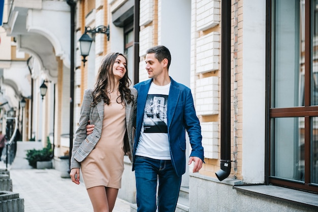 Man and woman walk in the morning on the empty streets of old Europe