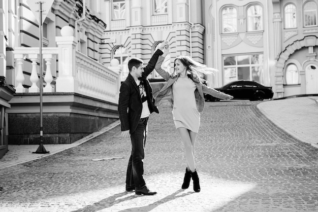 Man and woman walk in the morning on the empty streets of old Europe