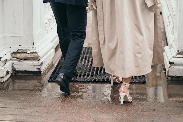 A man and a woman walk on the road