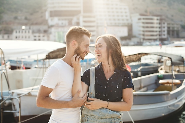 Man and woman walking on a wooden pier