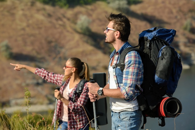 A man and a woman went hiking in the mountains.