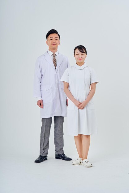 Man and woman in white coats