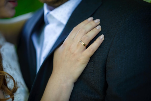 Man and woman with wedding ringYoung married couple holding hands