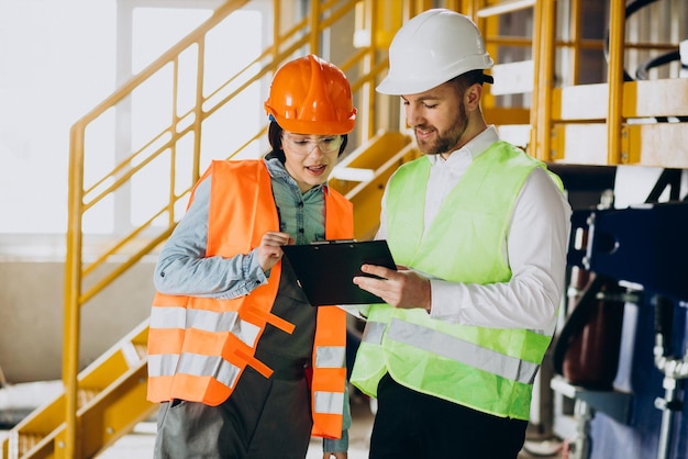 Man and woman working in a factory