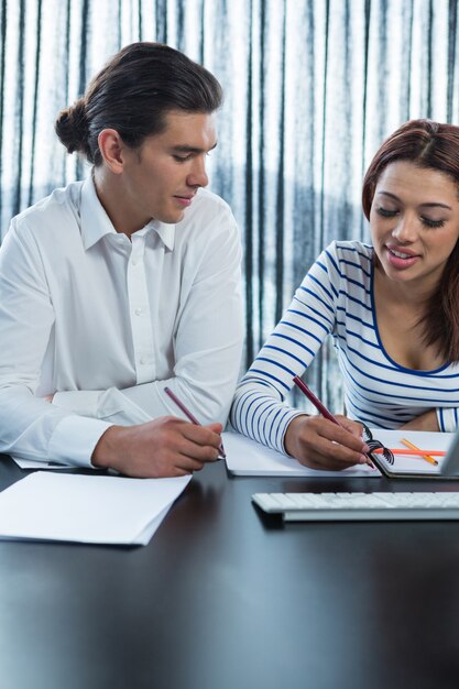 Man and woman working in office