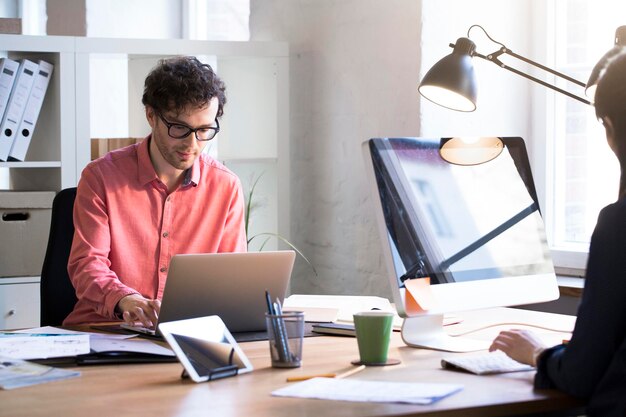 Man and woman working in office