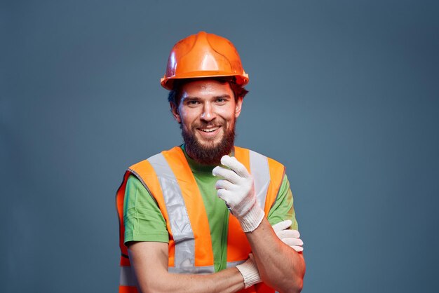 a man in a work uniform is a construction engineer industry professional orange hard hat high quality photo