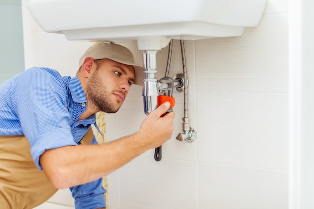 Man at work uniform with tools