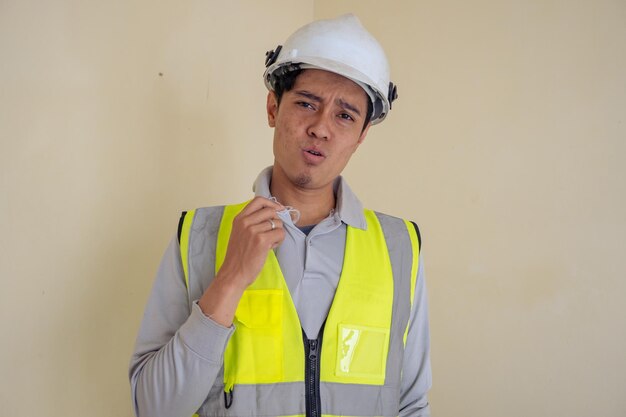 Man worker sweat at worksite hot weather today