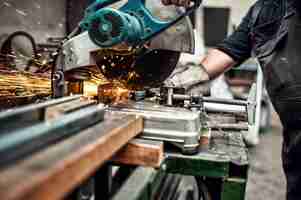 Photo man worker using a slinding compound mitre saw with circular bl