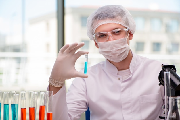 Man working in the chemical lab on science project