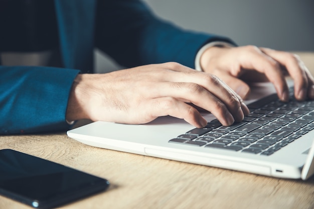 Man working in computer in office desk