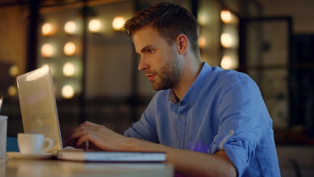 Man working on computer in office Overworked businessman putting head on hands