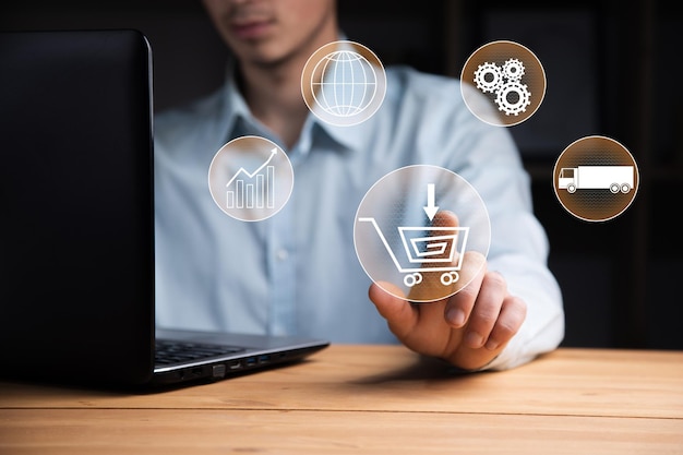 Man working computer with online shopping icon in screen