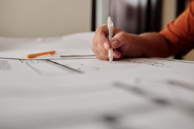 Man Working on Constructing Plan