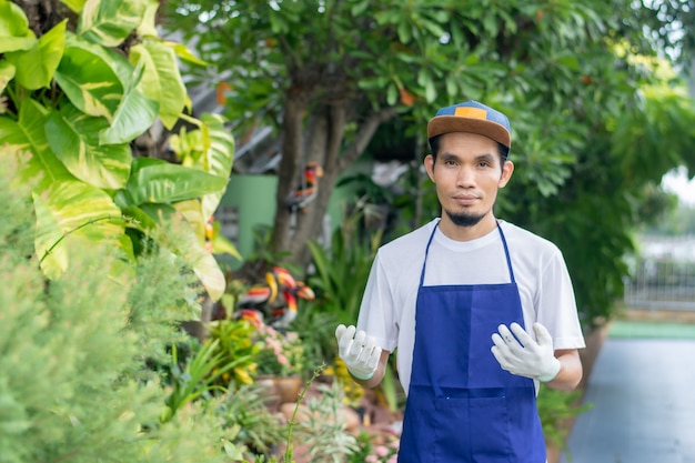 Man working employee in  ornamental plant shop