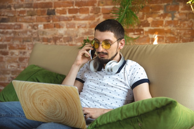 Man working from home during coronavirus or COVID-19 quarantine