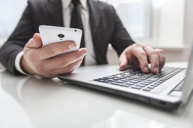 Man working from using smart phone