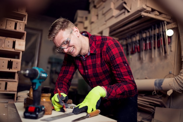 Man working hard in his workshop