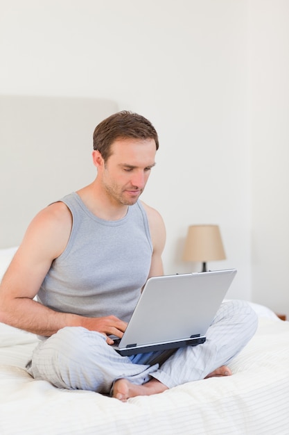 Man working on his laptop at home