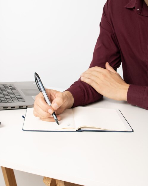 Photo man working home office writing notes