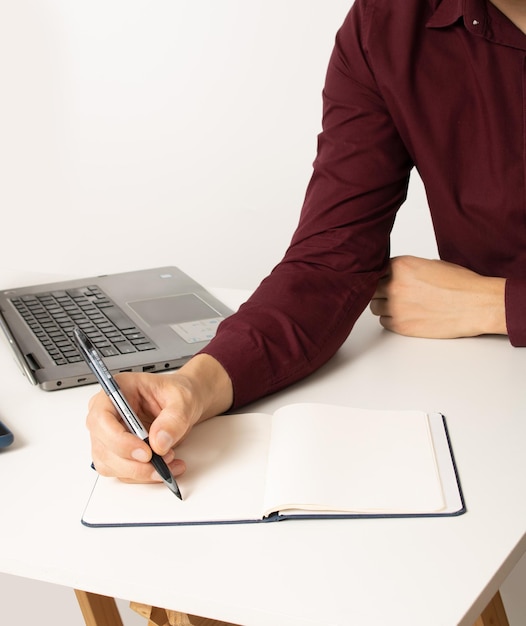 Photo man working home office writing notes