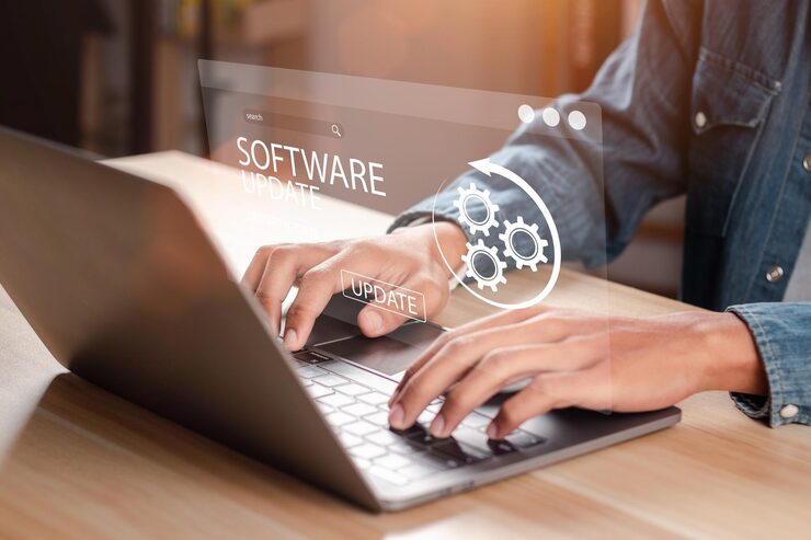 Photo man working and installing update process software updates or operating system upgrades to keep your device up to date with enhanced functionality in new versions and improved security